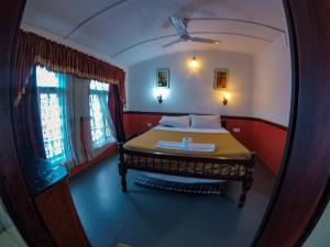 Kalappura Houseboats & Tours客房内的一张或多张床位