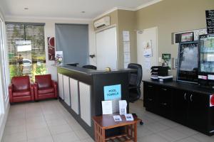 a hair salon with a waiting room with a cash register at Blackwater Motor Inn in Blackwater