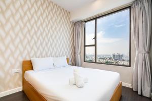Postel nebo postele na pokoji v ubytování Saigon Home Apartment - Infinity Pool + 37 fotografií