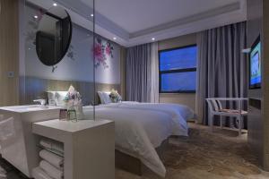 Paco Hotel Tianpingjia Metro Guangzhou - Free Shuttle Bus For Canton Fair客房内的一张或多张床位
