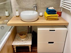 a bathroom with a sink on a wooden counter at Chalet cosy dominant le village in Lus-la-Croix-Haute +99 photos