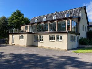 a large building with a lot of windows on it at Mingulay, Cuil Bay in Appin