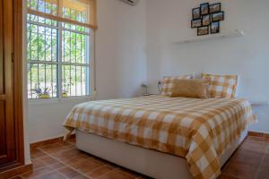 Ένα ή περισσότερα κρεβάτια σε δωμάτιο στο Finca El Limonar
