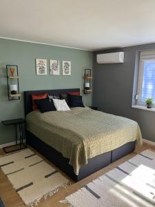 Postel nebo postele na pokoji v ubytování Újhely vára Apartman