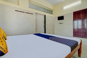 Cama o camas de una habitación en SPOT ON J P Tourist Home
