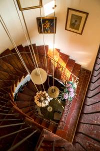 an overhead view of a spiral staircase in a house at Antica Osteria del Mirasole in San Giovanni in Persiceto