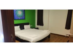 Кровать или кровати в номере Aarju Luxurious Stay Calangute