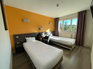 Postel nebo postele na pokoji v ubytování Hôtel Valpré + 37 fotografií