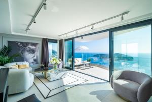a living room with a view of the ocean at Lux Kalifa 5 Star Exquisite Residence in Dubrovnik