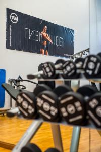 a man standing in front of a screen in a gym at Dunas Club - Hotel & Apartamentos in Corralejo