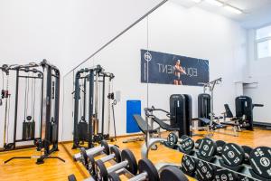 a gym with rows of treadmills and machines at Dunas Club - Hotel & Apartamentos in Corralejo