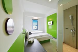Voodi või voodid majutusasutuse POP! Hotel Malioboro - Yogyakarta toas