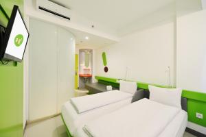 Voodi või voodid majutusasutuse POP! Hotel Malioboro - Yogyakarta toas