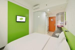 Voodi või voodid majutusasutuse POP! Hotel Malioboro - Yogyakarta toas