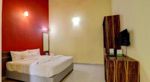 Postel nebo postele na pokoji v ubytování Lazo Areca Resort , Coorg