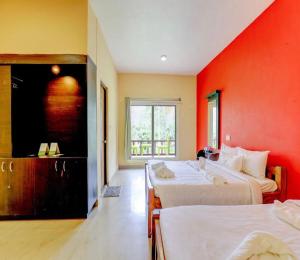 Postel nebo postele na pokoji v ubytování Lazo Areca Resort , Coorg
