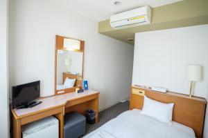 Postel nebo postele na pokoji v ubytování Hotel Casabella Inn Kobe