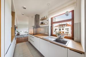 Kuchyň nebo kuchyňský kout v ubytování Liberty Premium by Baltica Apartments