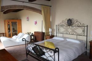 Postel nebo postele na pokoji v ubytování Hotel Relais Palazzo di Luglio