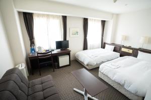 Postel nebo postele na pokoji v ubytování Hotel Casabella Inn Kobe