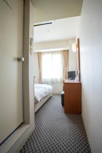 Postel nebo postele na pokoji v ubytování Hotel Casabella Inn Kobe