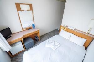 Postel nebo postele na pokoji v ubytování Hotel Casabella Inn Kobe