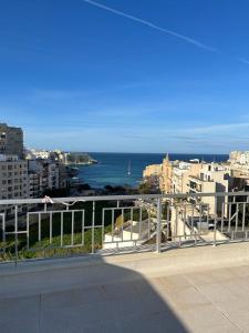 a view of the ocean from a balcony at Seaview Penthouse Balluta Bay VC in St Julian's