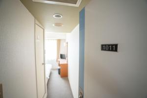Postel nebo postele na pokoji v ubytování Hotel Casabella Inn Kobe