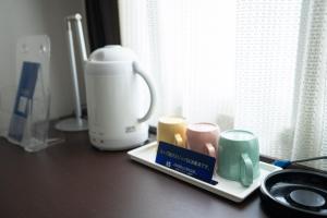 Příslušenství pro přípravu čaje a kávy v ubytování Hotel Casabella Inn Kobe