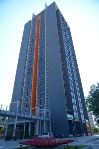 a large tall building with an orange at KA1707 - Cyberjaya-Netflix-Wifi- Parking, 1005 in Cyberjaya