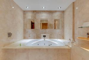 a large bathroom with a tub in a room at Boutique 56 in Liverpool