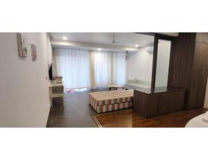 Кровать или кровати в номере Aarju Luxurious Stay Calangute