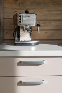 a sewing machine sitting on top of a white drawer at Kruszkanawierzbie in Kruszka