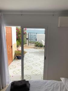 a bedroom with a door leading to a patio at Villa Tranquila, Playa del Duque in Adeje