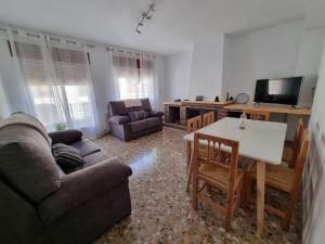 a living room with a couch and a table at Casa Conce in Riópar