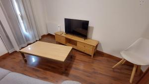 TV a/nebo společenská místnost v ubytování PALACIO REAL 2B