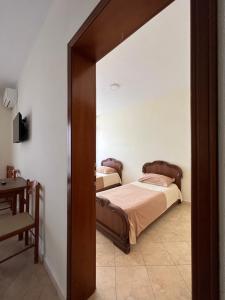 Letto o letti in una camera di Hotel Antik