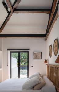 a bedroom with a large bed and a window at Auberge hiribarren in Biriatou