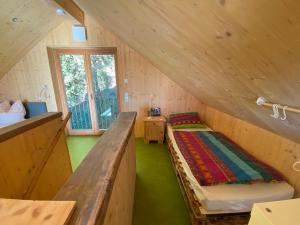 a room with two beds in a wooden house at Ferienhaus Andadoana in Kelheim