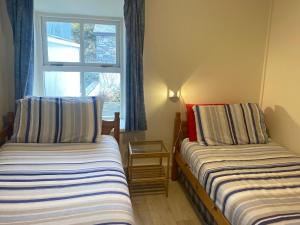 Voodi või voodid majutusasutuse Cottage 170 - Roundstone toas