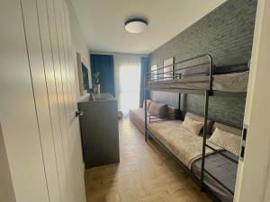 Posteľ alebo postele v izbe v ubytovaní Apartament I Młyny Gdańskie blisko centrum