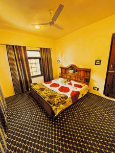 a bedroom with a large bed in a room at Sea Green Guest House in Srinagar