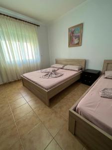 Postel nebo postele na pokoji v ubytování Apartment Kune,Shëngjin