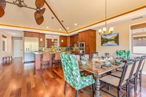 a dining room and kitchen with a table and chairs at 3Bd Kamilo 349 Home At Mauna Lani Resort in Waikoloa