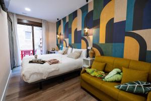 Center Suite Acebedos客房内的一张或多张床位