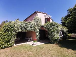 a house with a bunch of ivy growing around it at Muralto - 5 Bedroom Villa with Panoramic Pool in Penna in Teverina