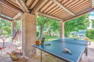 a ping pong table in a pavilion with a pool table at Muralto - 5 Bedroom Villa with Panoramic Pool in Penna in Teverina