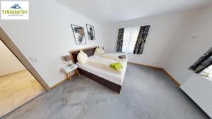 Postel nebo postele na pokoji v ubytování Apartementhaus Schöndorfer