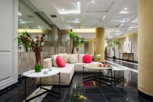 a living room with a couch and two tables at 1253 Recoleta Small Hotel in Buenos Aires +45 photos