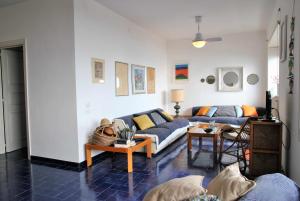 a living room with a couch and a table at Casa Edy fronte mare in Latina